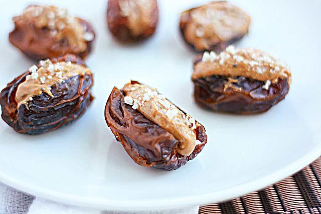 Delicious Whole30 snack that includes dates, nut butter, and salt